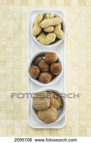 High angle view of nuts in bowls View Large Photo Image Stock Photograph - High angle view of nuts in bowls . Fotosearch