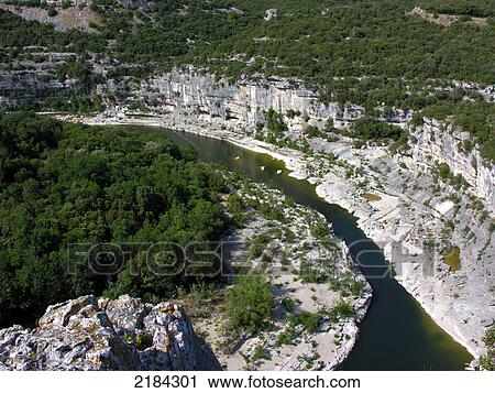 Stock Image - High angle view of river flowing through forest . Fotosearch