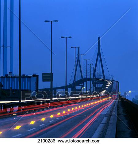 Stock Photograph - High angle view of traffic in motion at dusk, Germany . Fotosearch