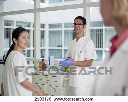 Lab technicians working in lab View Large Photo Image Stock Photograph - Lab technicians working in lab . Fotosearch