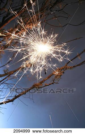 Low angle view of fireworks in sky View Large Photo Image Stock Photo - Low angle view of fireworks in sky . Fotosearch