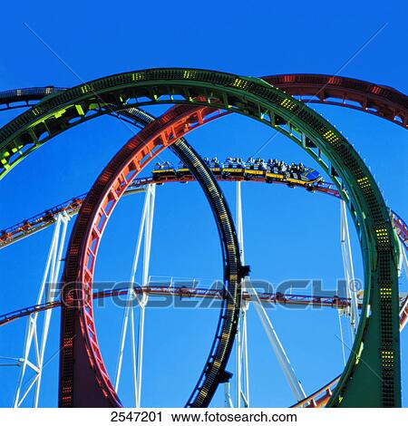 Low angle view of people sitting on rollercoaster View Large Photo Image Stock Image - Low angle view of people sitting on rollercoaster . Fotosearch
