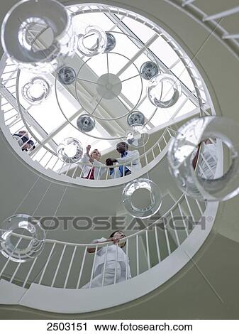 Stock Image - Low angle view of spiral staircase in hospital . Fotosearch