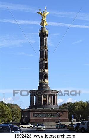 Low angle view of statue of angel on column View Large Photo Image Stock Image - Low angle view of statue of angel on column . Fotosearch
