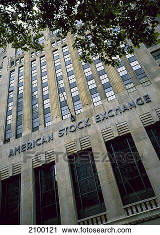 Stock Image - Low angle view of stock exchange building, New York Stock Exchange, Wall Street, New York City, New York State, USA . Fotosearch