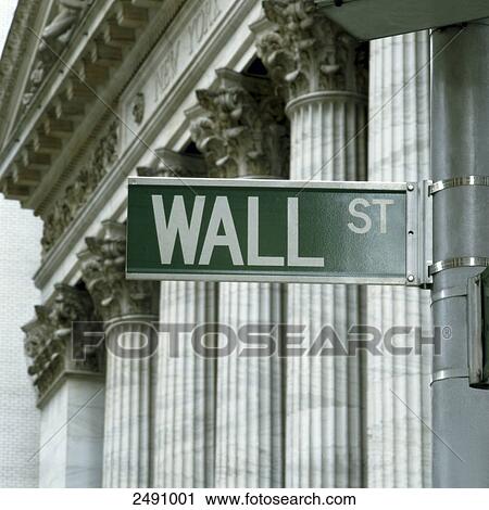 Stock Image - Low angle view of street name sign, Wall Street, Manhattan, New York City, New York State, USA . Fotosearch