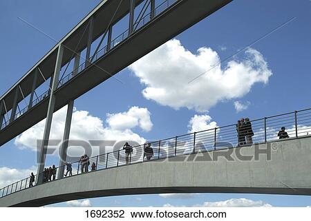 Low angle view of tourists on bridge View Large Photo Image Stock Image - Low angle view of tourists on bridge . Fotosearch