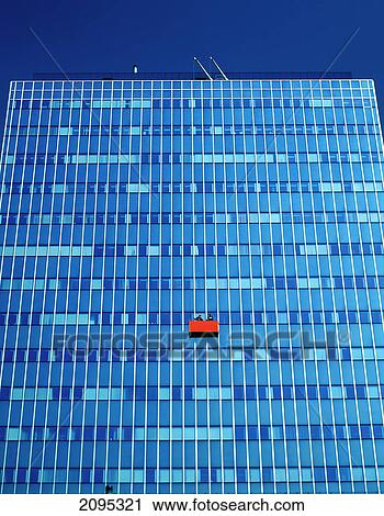 Low angle view of two people in basket cleaning windows, Germany View Large Photo Image Stock Image - Low angle view of two people in basket cleaning windows, Germany . Fotosearch