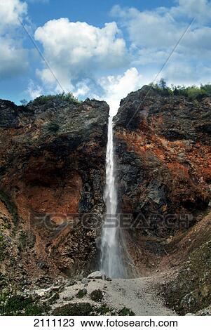 Stock Image - Low angle view of waterfall . Fotosearch