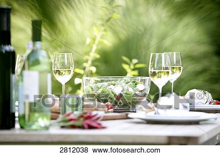 Lunch served on table with wine View Large Photo Image Stock Photo - Lunch served on table with wine . Fotosearch