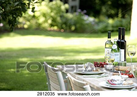 Stock Photography - Lunch served on table with wine . Fotosearch