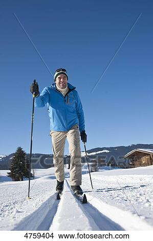Man cross-country skiing, Tannheimer Tal, Tyrol, Austria View Large Photo Image Picture - Man cross-country skiing, Tannheimer Tal, Tyrol, Austria . Fotosearch