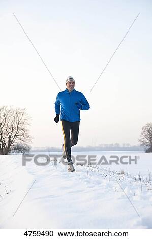 Man jogging in snow, Tannheimer Tal, Tyrol, Austria View Large Photo Image Stock Image - Man jogging in snow, Tannheimer Tal, Tyrol, Austria . Fotosearch
