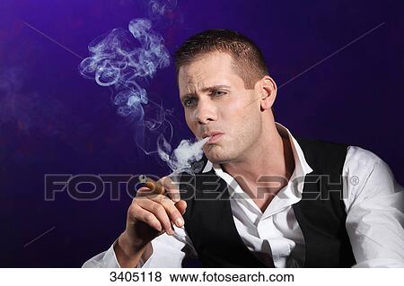 Stock Photo - Man smoking a cigar . Fotosearch