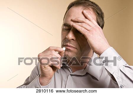 Man taking medicine View Large Photo Image Stock Photograph - Man taking medicine . Fotosearch