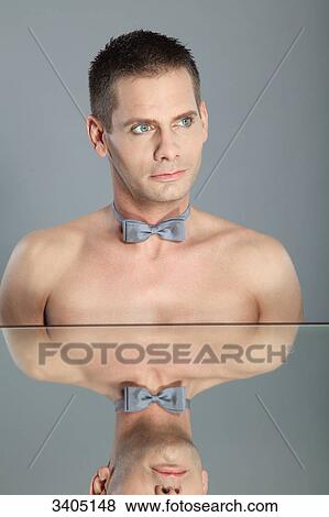Man wearing bow tie, portrait View Large Photo Image Stock Photo - Man wearing bow tie, portrait . Fotosearch