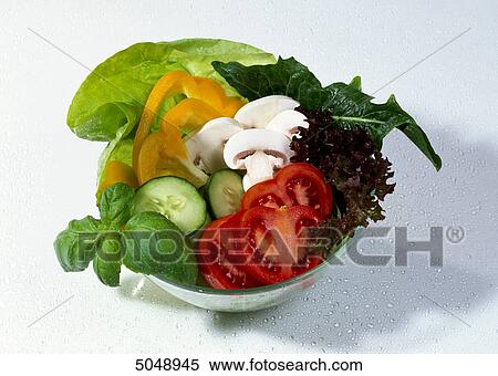 Mixed salad with tomato, basil, cucumber, champignon, paprika, dandelion, frisee lettuce and butterfield lettuce View Large Photo Image Stock Photography - Mixed salad with tomato, basil, cucumber, champignon, paprika, dandelion, frisee lettuce and butterfield lettuce . Fotosearch