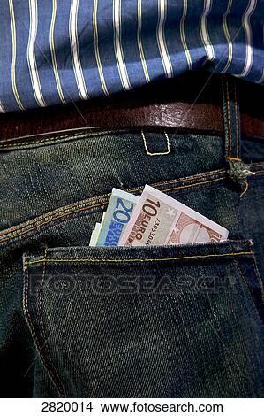 Picture - Money in pocket of jeans of person . Fotosearch