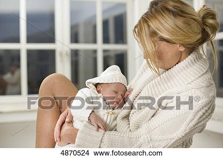 Mother holding baby View Large Photo Image Picture - Mother holding baby . Fotosearch