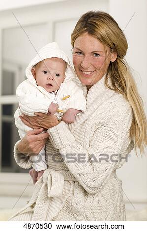 Mother holding baby View Large Photo Image Stock Image - Mother holding baby . Fotosearch