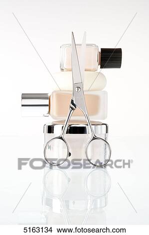 Picture - Nail scissors and nail varnish . Fotosearch