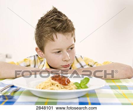 Noodles in front of boy View Large Photo Image Stock Image - Noodles in front of boy . Fotosearch