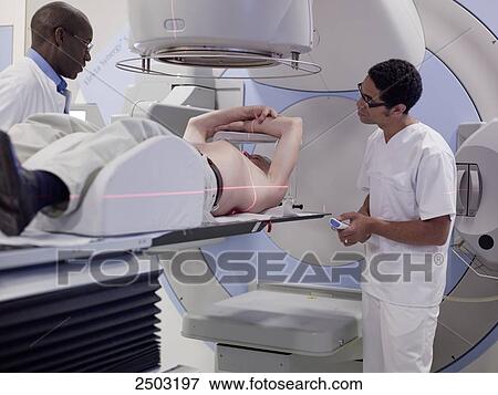 Stock Photo - Patient getting MRI scan . Fotosearch