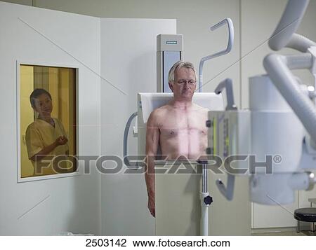 Stock Image - Patient having x-ray examination . Fotosearch