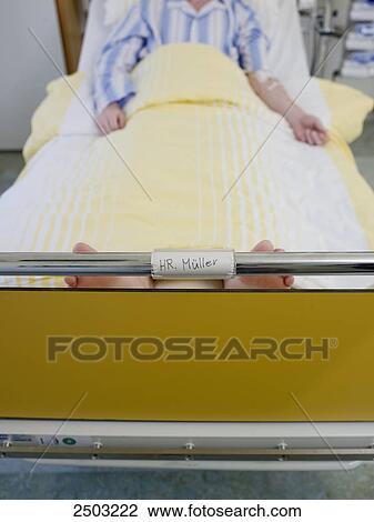 Patient lying in hospital bed View Large Photo Image Stock Image - Patient lying in hospital bed . Fotosearch