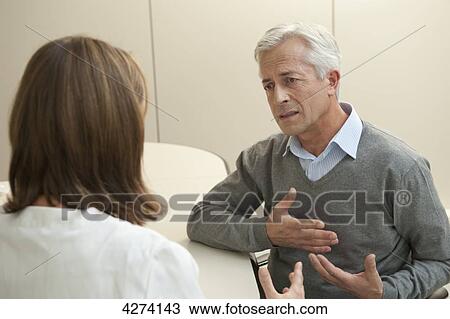 Patient talking to female doctor View Large Photo Image Stock Image - Patient talking to female doctor . Fotosearch