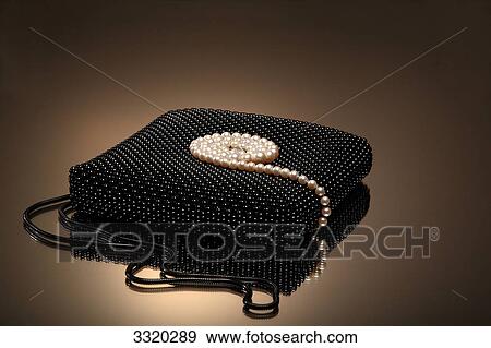 Pearl necklace on a jewelry cushion, close-up View Large Photo Image Stock Photo - Pearl necklace on a jewelry cushion, close-up . Fotosearch
