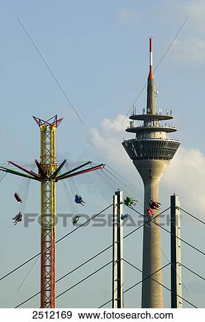 People on chain swing ride View Large Photo Image Stock Photo - People on chain swing ride . Fotosearch