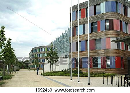 Person walking in front of building View Large Photo Image Stock Image - Person walking in front of building . Fotosearch