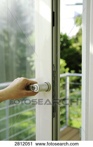 Person's hand opening door View Large Photo Image Stock Image - Person's hand opening door . Fotosearch