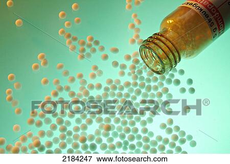 Pills spilling from bottle View Large Photo Image Stock Photo - Pills spilling from bottle . Fotosearch