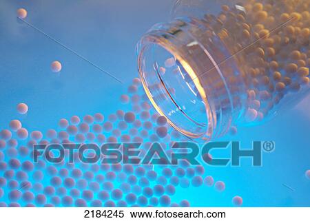 Stock Photography - Pills spilling from bottle . Fotosearch