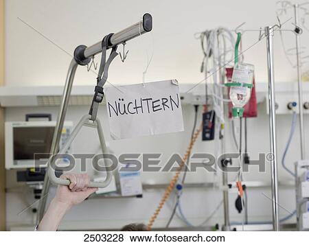 Stock Photo - Placard hanging on patient's bed in hospital . Fotosearch