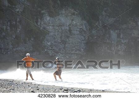 Playful senior couple on beach, Italy, Sori View Large Photo Image Stock Photo - Playful senior couple on beach, Italy, Sori . Fotosearch