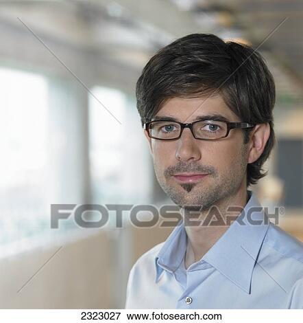 Portrait of businessman smiling View Large Photo Image Stock Photo - Portrait of businessman smiling . Fotosearch