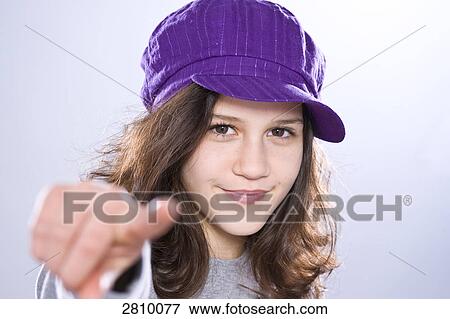 Portrait of girl gesturing and smiling View Large Photo Image Stock Photo - Portrait of girl gesturing and smiling . Fotosearch
