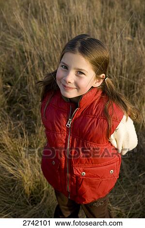 Stock Image - Portrait of girl smiling . Fotosearch