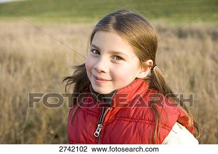 Stock Image - Portrait of girl smiling . Fotosearch
