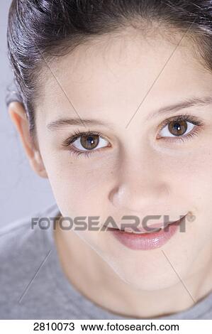 Stock Image - Portrait of girl smiling . Fotosearch