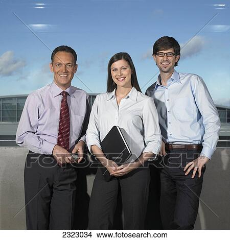 Picture - Portrait of three businesspeople smiling . Fotosearch