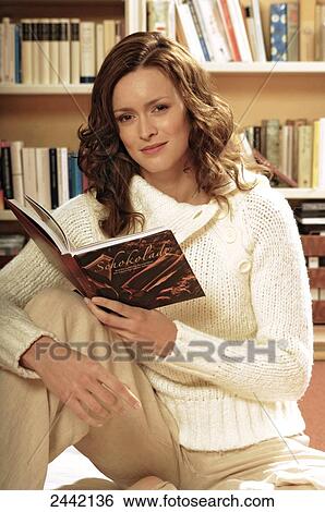 Stock Photograph - Portrait of woman reading book . Fotosearch