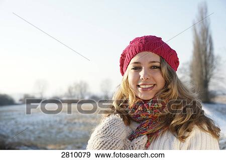 Portrait of woman smiling in warm clothing View Large Photo Image Stock Photo - Portrait of woman smiling in warm clothing . Fotosearch