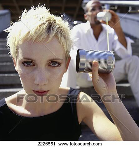 Portrait of woman using tin can phone View Large Photo Image Stock Image - Portrait of woman using tin can phone . Fotosearch