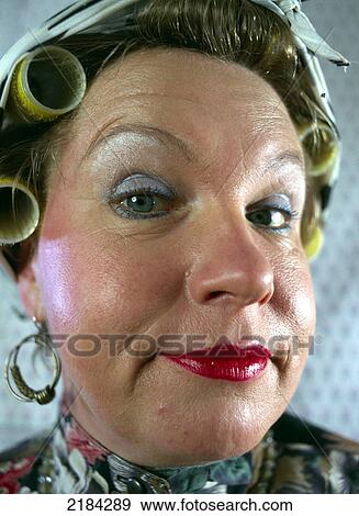 Portrait of woman with curlers in her hair View Large Photo Image Stock Photo - Portrait of woman with curlers in her hair . Fotosearch