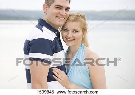 Portrait of young couple smiling View Large Photo Image Stock Photography - Portrait of young couple smiling . Fotosearch
