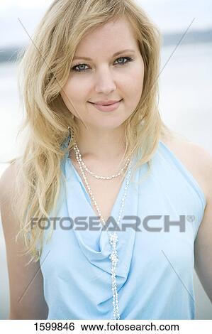 Portrait of young woman smiling View Large Photo Image Stock Photograph - Portrait of young woman smiling . Fotosearch